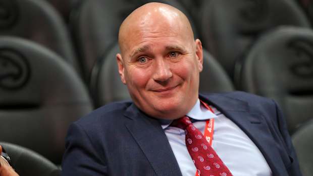 Travis Schlenk watches a game from the stands.
